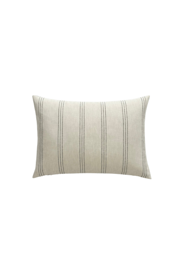 A large lumbar decorator throw pillow with an off white fabric, 6 vertical bars comprised of three lines are evenly spaced across the pillow.  