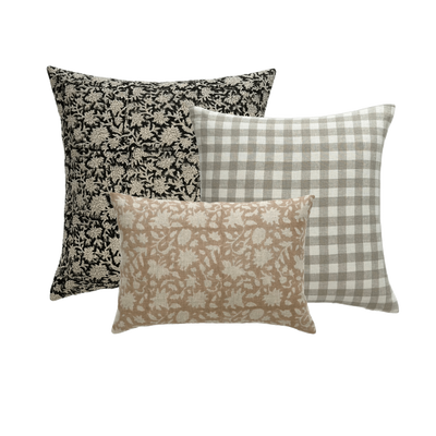 A collection of 3 decorator throw pillows with different colors and patterns. 